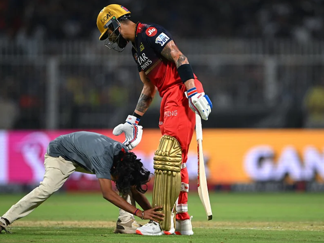 a virat kohli fan breaches security to meet the star during kkr vs rcb ipl 2025 match photo afp