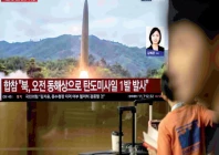 news coverage shows file footage of a north korean missile launch on a screen at seoul station in seoul on october 3 2026 photo afp