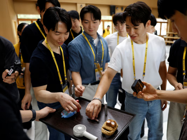 Participants choose from items displayed on a tray to determine their partners for a date during a Buddhist temple matchmaking programme at Naksansa temple in Yangyang, South Korea, July 11, 2026. PHOTO: Reuters
