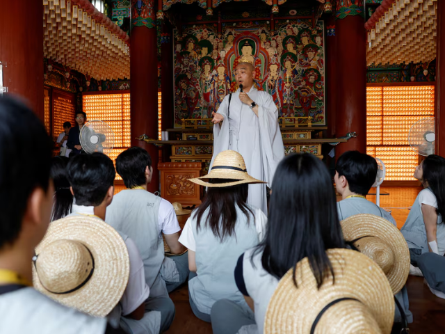 A Buddhist monk speaks to participants during a Buddhist temple matchmaking programme at Naksansa temple in Yangyang, South Korea, July 11, 2026. PHOTO: Reuters