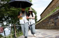 a participant guides a blindfolded partner along a stone path during a buddhist temple matchmaking programme at naksansa temple in yangyang south korea july 11 2026 photo reuters a participant guides a blindfolded partner along a stone path during a buddhist temple matchmaking programme at naksansa temple in yangyang south korea july 11 2026 photo reuters