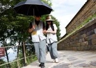 a participant guides a blindfolded partner along a stone path during a buddhist temple matchmaking programme at naksansa temple in yangyang south korea july 11 2026 photo reuters a participant guides a blindfolded partner along a stone path during a buddhist temple matchmaking programme at naksansa temple in yangyang south korea july 11 2026 photo reuters