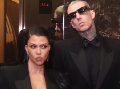 kourtney kardashian stands by travis barker at blink 182 show in los angeles