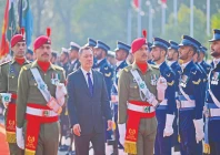 kyrgyzstan s president sadyr japarov inspects the guard of honour at the prime minister house in islamabad photo afp