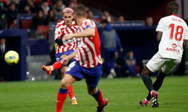 atletico thrash sevilla to move third
