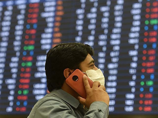a stockbroker watches share prices at the pakistan stock exchange photo afp a stockbroker watches share prices at the pakistan stock exchange photo afp