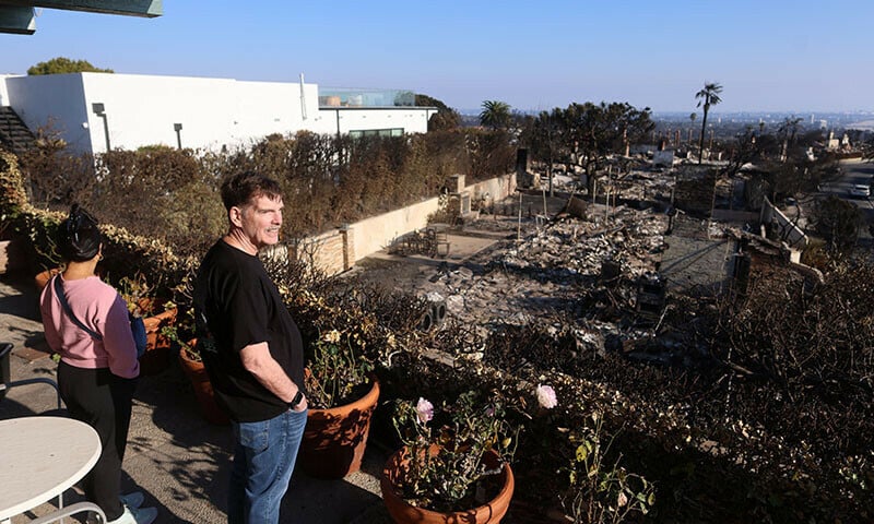 greg and helen levin look at their undamaged home in the palisades for the first time in los angeles california on january 18 photo reuters