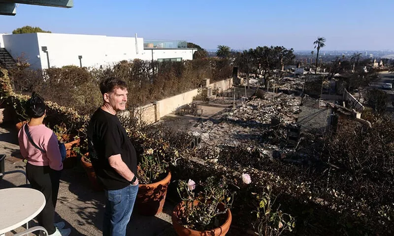 greg and helen levin look at their undamaged home in the palisades for the first time in los angeles california on january 18 photo reuters greg and helen levin look at their undamaged home in the palisades for the first time in los angeles california on january 18 photo reuters