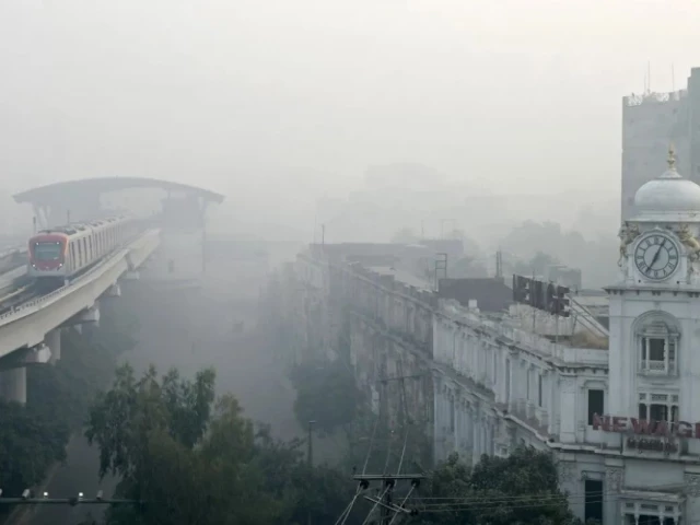 a 2024 image of lahore city shows thick smog on a busy route photo afp