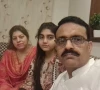 dsp muhammad usman haider is seen in a photograph with his slain wife and daughter photo express
