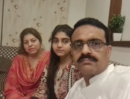 dsp muhammad usman haider is seen in a photograph with his slain wife and daughter photo express
