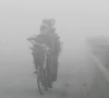 a man rides a bicycle on a smoggy morning in lahore pakistan photo reuters file