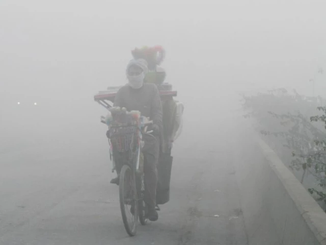 a man rides a bicycle on a smoggy morning in lahore pakistan photo reuters file a man rides a bicycle on a smoggy morning in lahore pakistan photo reuters file