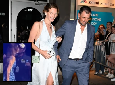 lana del rey shares pda with husband onstage at cardiff concert