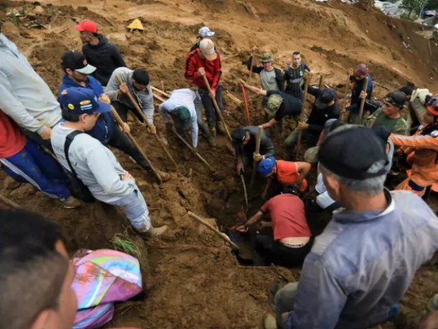 locals help rescuers as they search for victims and survivors following a landslide that killed at least 10 people in bello photo afp locals help rescuers as they search for victims and survivors following a landslide that killed at least 10 people in bello photo afp