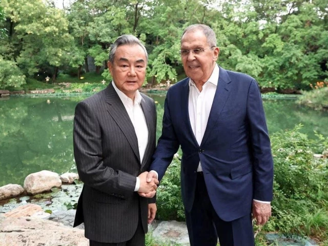chinese foreign minister wang yi shakes hands with russian foreign minister sergei lavrov during a meeting on the sidelines of the shanghai cooperation organisation sco foreign ministers council meeting in beijing china july 13 2025 photo reuters chinese foreign minister wang yi shakes hands with russian foreign minister sergei lavrov during a meeting on the sidelines of the shanghai cooperation organisation sco foreign ministers council meeting in beijing china july 13 2025 photo reuters