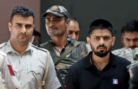 policemen escort lawrence bishnoi at a court in new delhi india on april 18 2023 photo reuters file