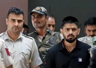 policemen escort lawrence bishnoi at a court in new delhi india on april 18 2023 photo reuters file