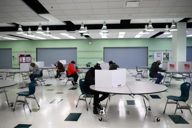 people fill in their ballots at wakefield high school on the day of the 2020 us presidential election in arlington virginia us november 3 2020 photo reuters file people fill in their ballots at wakefield high school on the day of the 2020 us presidential election in arlington virginia us november 3 2020 photo reuters file