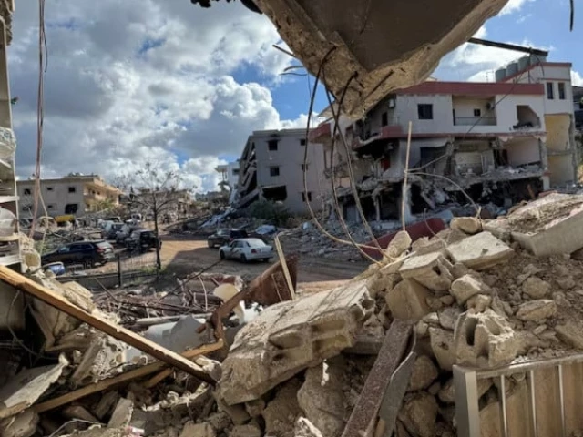 cars drive past damaged buildings as residents return to naqoura near the border with israel southern lebanon january 23 2025 photo reuters cars drive past damaged buildings as residents return to naqoura near the border with israel southern lebanon january 23 2025 photo reuters
