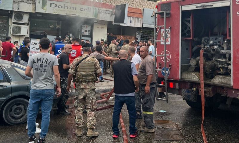 people and first responders gather at the scene of a reported device explosion in saida in southern lebanon on september 18 2024 photo afp