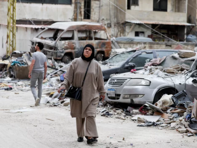 a woman walks past damaged vehicles in the aftermath of an israeli airstrike in beirut lebanon april 1 2025 photo reuters a woman walks past damaged vehicles in the aftermath of an israeli airstrike in beirut lebanon april 1 2025 photo reuters