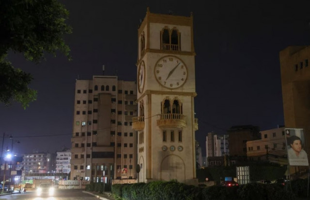 a car drives near a clock tower in jdeideh lebanon march 25 2023 reuters mohamed azakir
