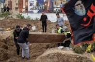 workers remove a coffin with a body from temporary graves and prepare for transport for a funeral ceremony of four hezbollah fighters and two civilians amid a temporary ceasefire between lebanon and israel in tyre southern lebanon april 26 2026 photo reuters