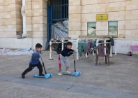 children play outside camille chamoun sports city stadium turned into a temporary shelter in beirut lebanon may 8 2026 reuters