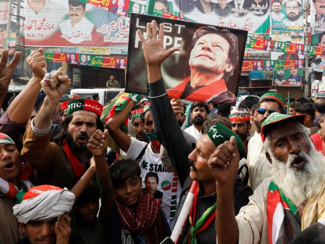 pti supporters condemn the attack on the long march convoy held by pakistan s former leader imran khan in wazirabad photo reuters