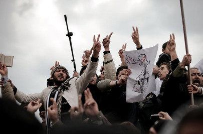 troops kill tripoli protesters gaddafi defiant