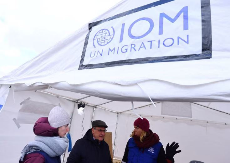 director general of the international organization for migration iom antonio vitorino visits an information booth at the border checkpoint where people are crossing the border from ukraine to poland after fleeing the russian invasion of ukraine in medyka poland march 10 2022 photo reuters