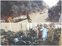 vendors watch helplessly as their livelihoods went up in flames leaving behind smoke engulfing the lighthouse area as a massive fire tore through a bustling flea market reducing 70 makeshift stalls and countless goods to ashes photo jalal qureshi express