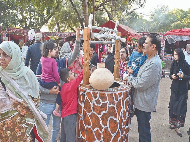visitors enjoy exploring traditional cultural displays at the lok mela 2025 a ten day annual folk festival at lok virsa islamabad showcasing pakistan s diverse heritage and craftsmanship photo app