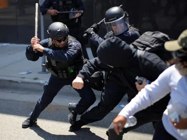 members of the los angeles metro police clash with demonstrators during a protest against federal immigration sweeps in downtown los angeles june 8 photo reuters