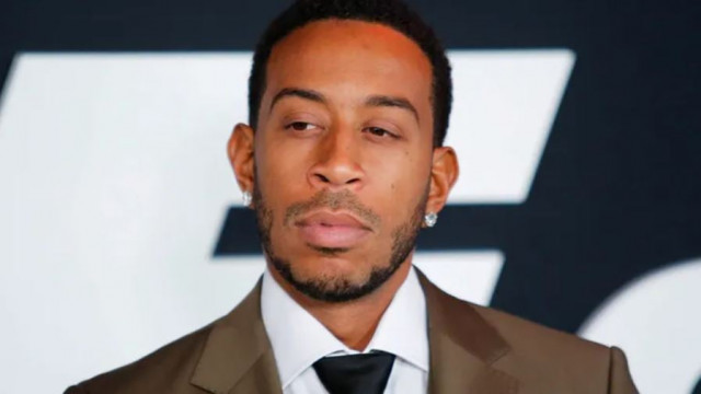 ludacris channels iconic music videos with giant prosthetic arms during atlanta braves first pitch ludacris channels iconic music videos with giant prosthetic arms during atlanta braves first pitch