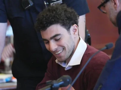 more than 20 women show up in court to support luigi mangione as he pleads not guilty