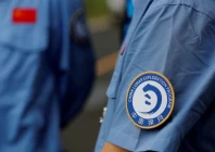 a badge of china lunar exploration program is seen on an employee s uniform at wenchang space launch center in hainan province china november 23 2020 reuters