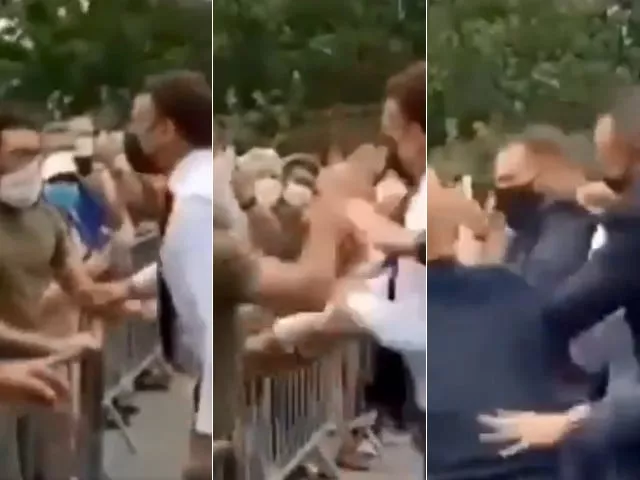 in video circulating on social media macron dressed in shirt sleeves could be seen walking towards a crowd of well wishers who were behind a metal barrier screen shots in video circulating on social media macron dressed in shirt sleeves could be seen walking towards a crowd of well wishers who were behind a metal barrier screen shots