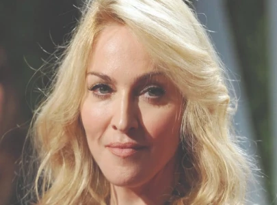 madonna springs a surprise at dolce gabbana show in milan