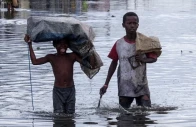 children wade through a flooded street after cyclone gezani tore through the port city of toamasina madagascar february 12 photo reuters