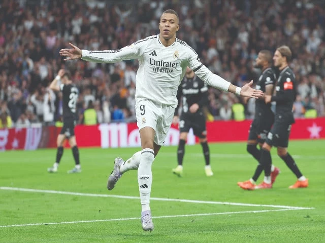 real madrid s kylian mbappe celebrates after converting a penalty during the laliga match against club deportivo leganes sad at the santiago bernabeu stadium in madrid on march 29 photo afp