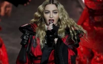 madonna returns to warner records with dance sequel album set for july release