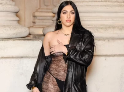 madonna s daughter lourdes leon wears revealing catsuit at saint laurent s paris fashion week show madonna s daughter lourdes leon wears revealing catsuit at saint laurent s paris fashion week show