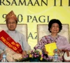 malaysia s former prime minister mahathir mohamad sits with his wife siti hasmah mohammad ali during the launching of perkasa a malay rights organisation in kuala lumpur march 27 2010 reuters