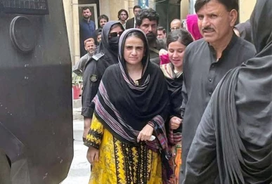 baloch yakjehti committee leader mahrang baloch is being escorted by police personnel during her appearance at an anti terrorism court in quetta on july 8 2025 photo ppi