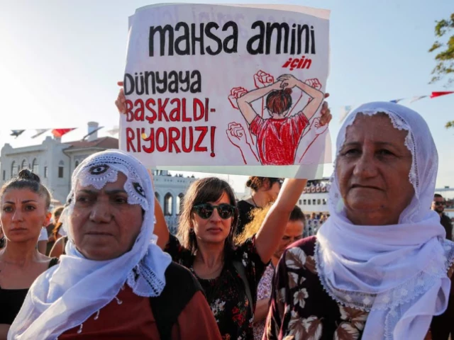 women take part in a rally on the first anniversary of the death of mahsa amini which prompted protests across the country in istanbul turkey september 16 2023 banner reads we revolt against world for mahsa amini photo reuters