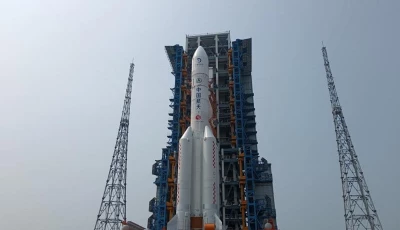 this photo taken on april 27 2024 shows the combination of the chang e 6 lunar probe and the long march 5 y8 carrier rocket having been transferred vertically to the launching area at the wenchang space launch center in south china s hainan province the chang e 6 lunar probe is scheduled for launch at an appropriate time at the beginning of may according to the china national space administration cnsa