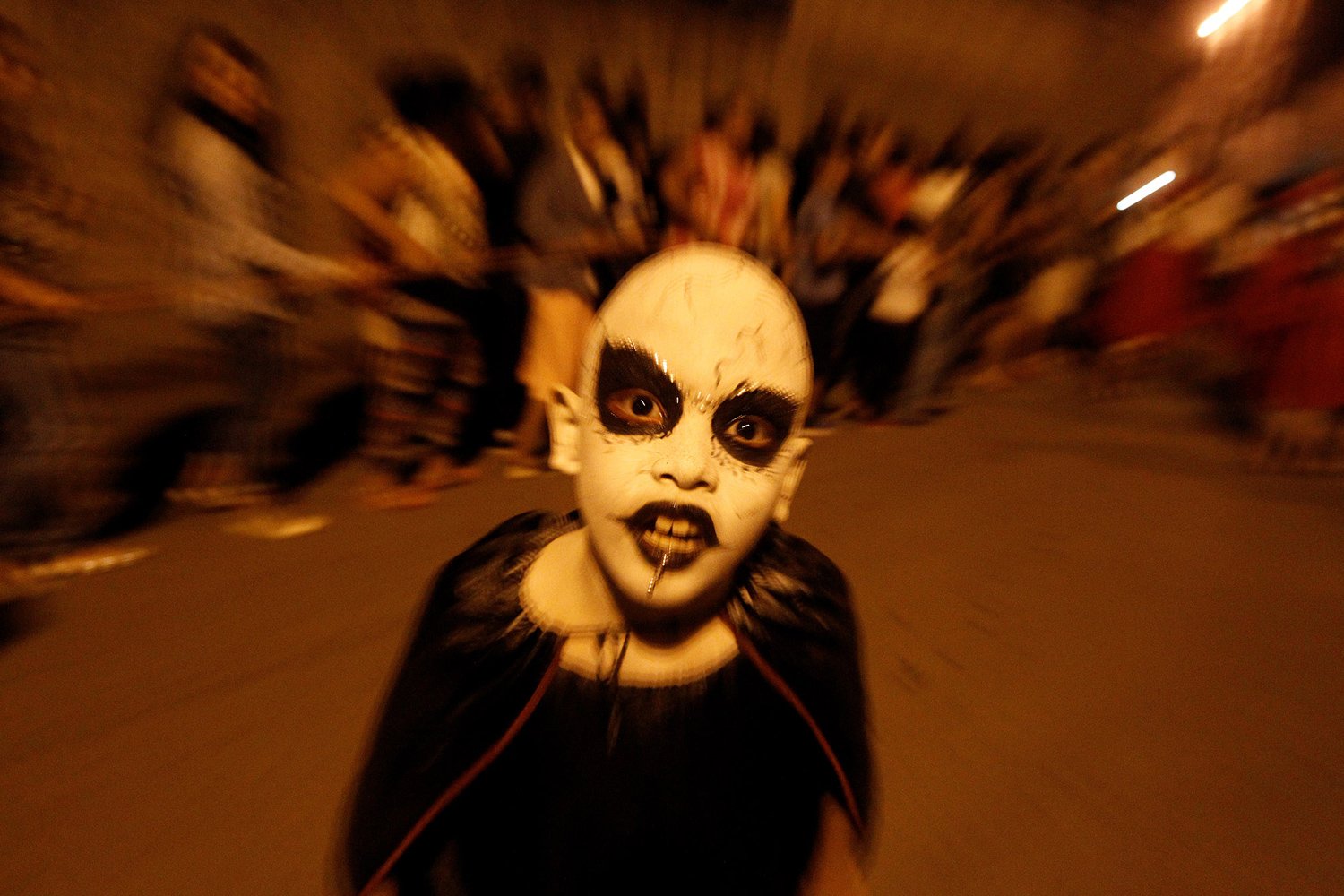 A child poses for a picture during a re-enactment of the Via Crucis (Way of the Cross) for Catholic children in Tegucigalpa, Honduras. PHOTO: REUTERS