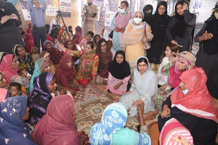 malala yousafzai speaks to women who have been affected by the floods in sindh photo sameer mandhro